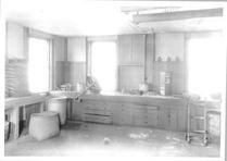 SA0454 - Shows a work area with baskets and built-in drawers. Identified on the back., Winterthur Shaker Photograph and Post Card Collection 1851 to 1921c